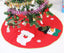 Red Christmas Tree Skirt draped at base of holiday tree, festive home decor