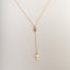 Small cross pendant necklace in gold and silver finish