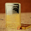 Golden Jesus Cross commemorative coin displayed in acrylic case