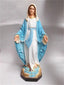 Sacred Heart of Jesus resin statue displayed on wooden shelf for home prayer space