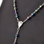 Colorful horn bead rosary necklace with alloy crucifix pendant displayed against a warm background