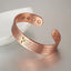 Red copper cross bracelet with magnetic elements displayed on a light background