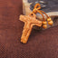 Embossed wood keychain pendant featuring a carved relief of Jesus