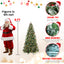 Pre-lit Christmas tree with red berry and pine cone decorations in warm white glow
