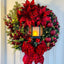 Illuminated Christmas wreath garland featuring Jesus motif with warm glowing lights for holiday decor