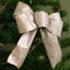 Shimmering Christmas glitter bow in red and gold colors for holiday tree