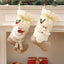 White Nordic Christmas stocking displayed on a festive mantel with greenery and candles