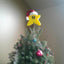 Yellow pixelated five-pointed star foam Christmas ornament with festive holiday styling