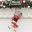 Christmas stocking ornament set with three festive designs displayed on a tree