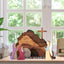 Wooden Easter creche with nativity figures in natural wood finish displayed as home ornament