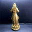 Bright gold Jesus Mercy resin sculpture standing on decorative base