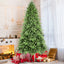 6ft PE/PVC mixed Christmas tree with 1168 tips standing in a festive living room