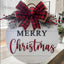 Christmas wooden doorplate garland hanging on door with festive decor