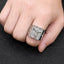 Men's vintage Jesus cross ring displayed at an angle on a dark surface