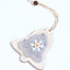 A wooden Christmas tree pendant with plush detailing hangs ready to bring festive warmth to your home