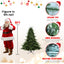Green PE/PVC Christmas tree with full branches in living room setting