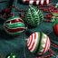 Set of colorful electroplated Christmas tree ornaments hanging in festive display