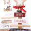 Wood Christmas tree letter decoration displayed on rustic shelf with warm lighting