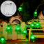 Green LED Christmas tree-shaped light string on dark background