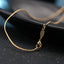 Gold-plated cross necklace pendant detail