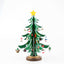 Festive wooden Christmas tree ornament set with red and green accents on natural wood background