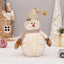 Long velvet snowman with pointed hat in festive setting