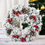 Handmade Christmas garland with flowers and knots on white background