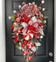 Festive Christmas door hanging with colorful wreath design on textured background