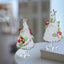 Handmade glass Christmas tree panel with red flowers on desk