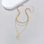 Gold-tone alloy pendant necklace featuring geometric Jesus symbol