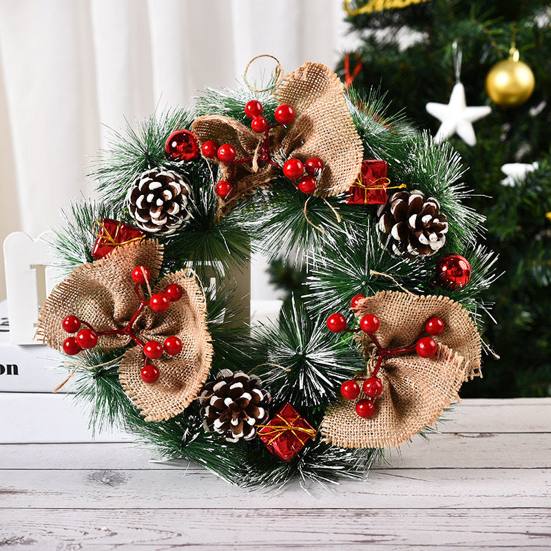 Close-up of white fruits and decorative knots on Christmas garland