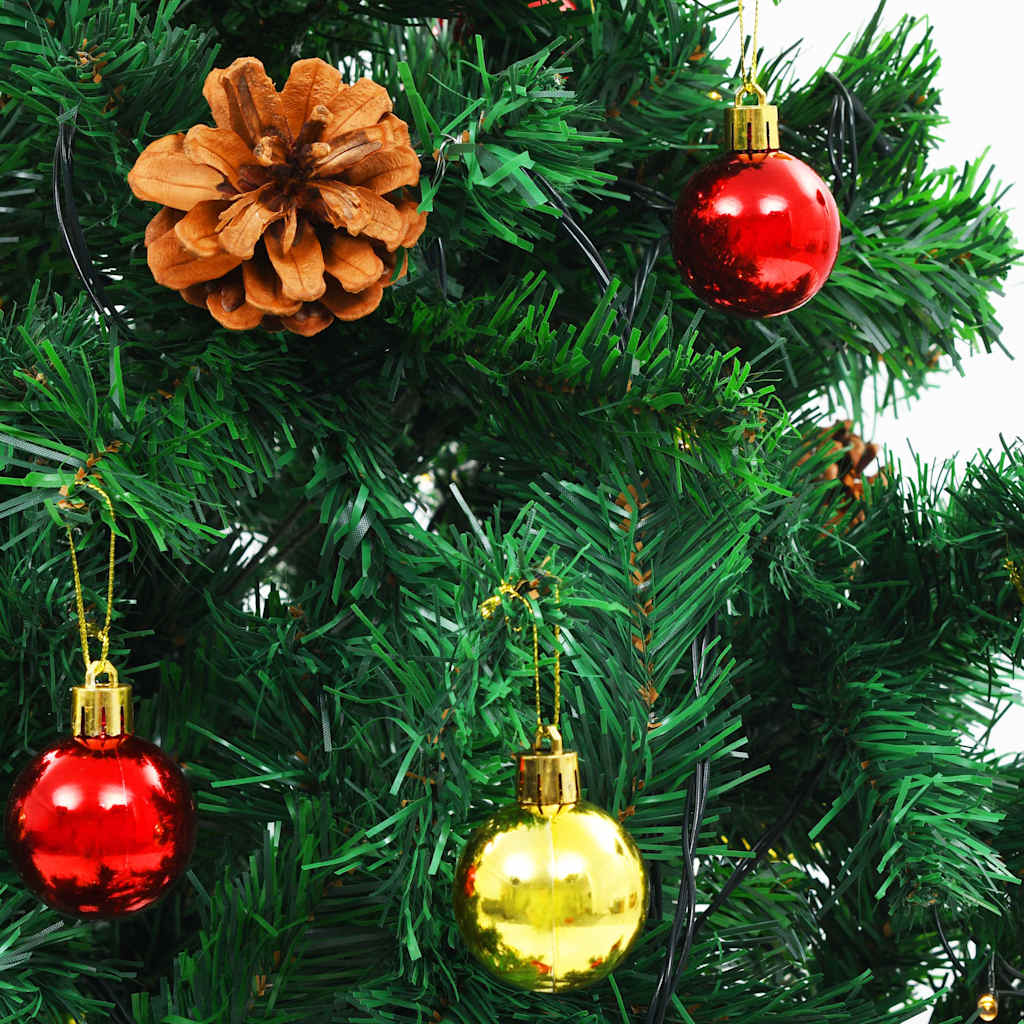 Fully decorated artificial Christmas tree with illuminated branches and ornaments