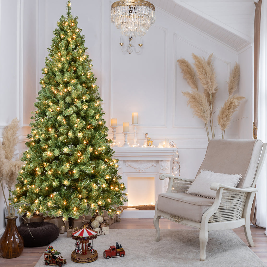 Close-up of green Christmas tree foliage and prelit branches