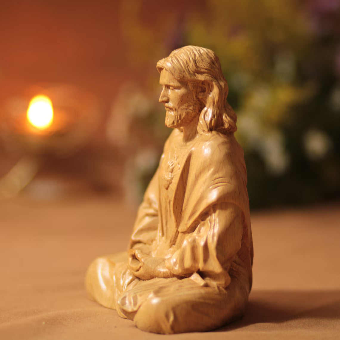 Close-up view of hand-painted Jesus resin figurine for holiday display