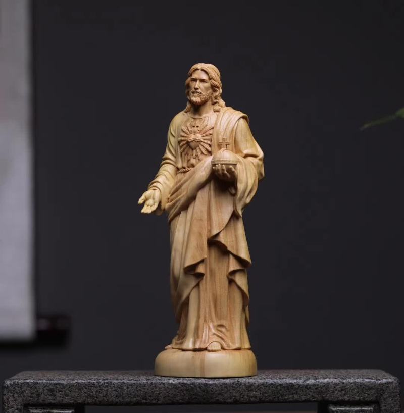 Small carved boxwood ornament showing two figures