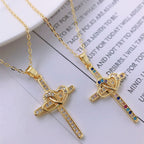 Gold cross pendant necklace with zircon accents on delicate chain