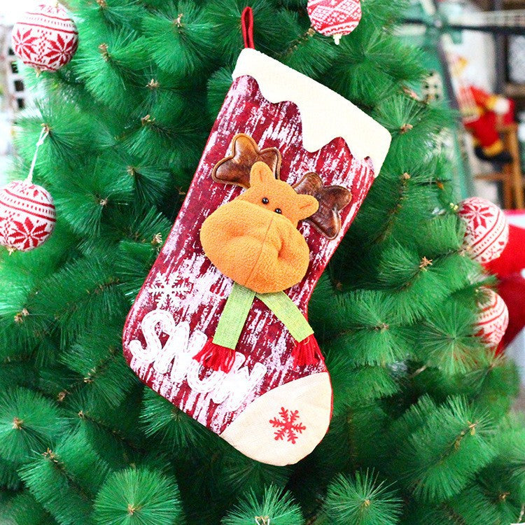 Christmas gift bag featuring knitted doll design