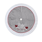 Close-up of cloth Christmas tree skirt showing intricate gloves design detail and quality fabric texture