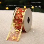 Festive fabric Christmas ribbon in rich red tones arranged for holiday display