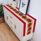Christmas polyester table runner with decorative patterns in warm lighting