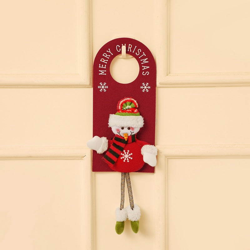 Festive Christmas door hanger with snowman design and scarf decorations on wooden door