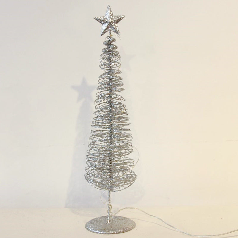 Christmas tree ornament in blue and gold with subtle illumination
