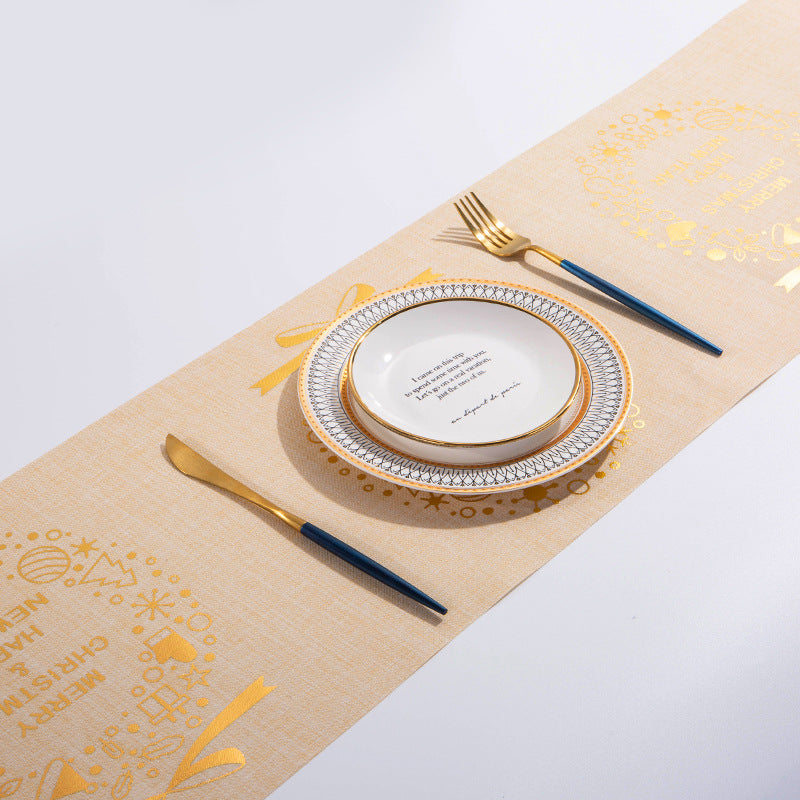 Festive Christmas table runner with elk and snowman design displayed on a dining table