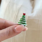 Creative hinged Christmas ornaments arranged as festive holiday display