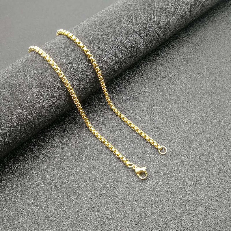Golden Jesus Christ pendant necklace with diamond accents, front view