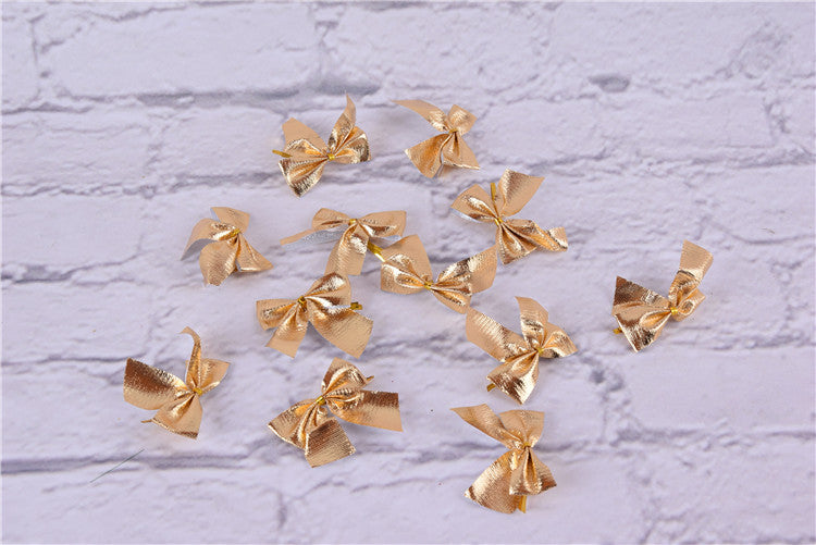 Assorted red gold silver Christmas bows flat lay - Simple Christmas Bow