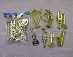 Assorted small musical instrument Christmas tree decorations arranged in festive holiday setting
