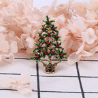 Green alloy brooch showcasing festive Christmas tree motif