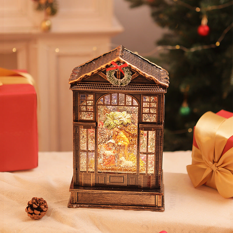 Close-up of Christmas music box resin detail and warm LED glow