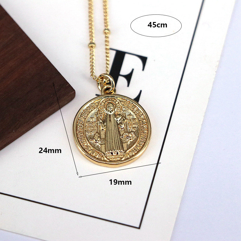 Stacked view of gold and silver Jesus bead necklaces together